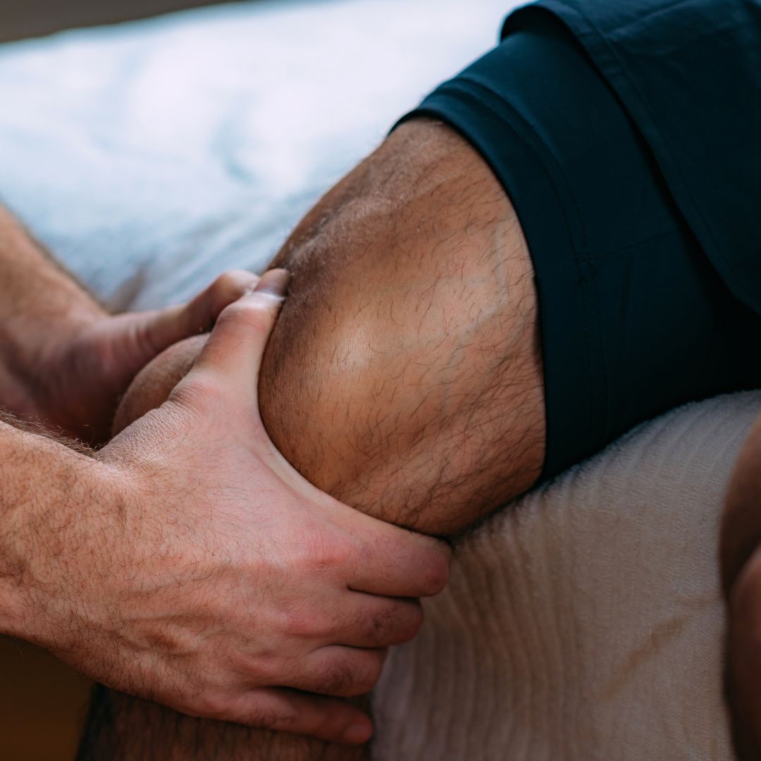 Sport massage — deep tissue work on the leg